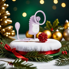 Load image into Gallery viewer, A lilac air sucking vibrator on top of a Christmas bauble