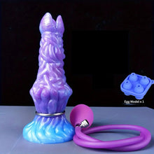 Load image into Gallery viewer, Blue and lavender  ovipositor dildo with a hand pump and egg mold  on a blue bench top.