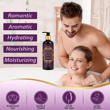 Load image into Gallery viewer, A man with a beard smiling while using the erotic massage oil on a woman laying in a bubble bath.