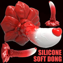 Load image into Gallery viewer, A red and white flower base dildo standing up right with a love heart on the top of the gland.