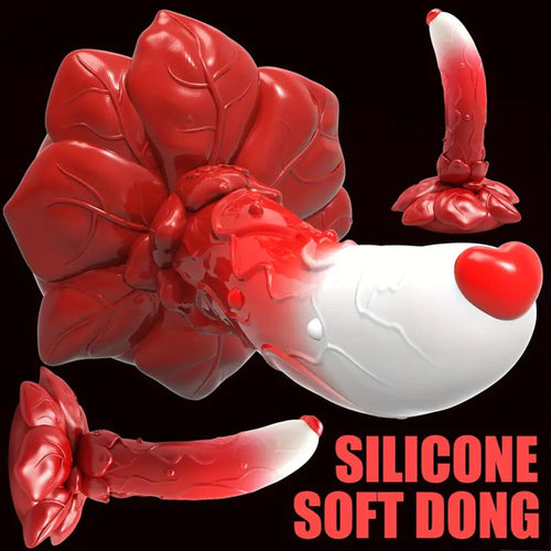 A red and white flower base dildo standing up right with a love heart on the top of the gland.